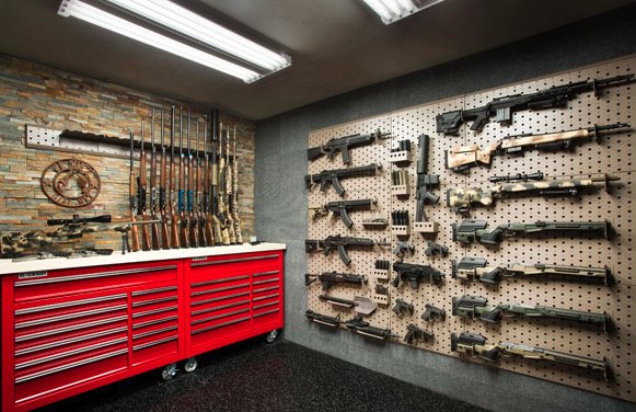 Secure storage room with a pegboard display wall and a rolling tool chest